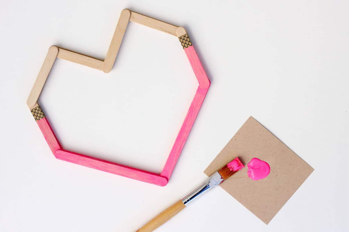 This DIY Valentine idea is perfect to make with kids (or not!) They are inexpensive, easy and double as wall art after Valentine's Day is over. Download the free template at MakeAndDoCrew.com