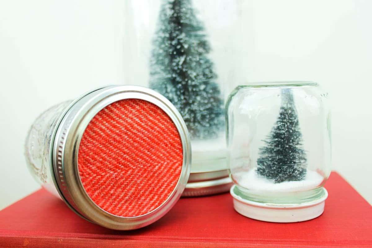 How to make Anthropologie knockoff snow globes with mason jars and salt. Easy and inexpensive Christmas gift idea. Click to see full tutorial. | MakeAndDoCrew.com