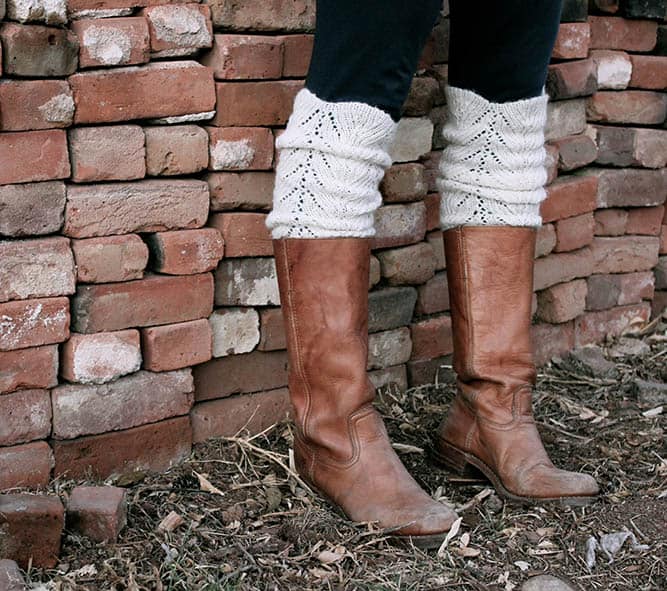 Make these super easy DIY legwarmers/boot toppers from the sleeves of an old sweater. Such a fast, adorable DIY gift idea with minimal sewing required. Click to see full tutorial. | MakeAndDoCrew.com