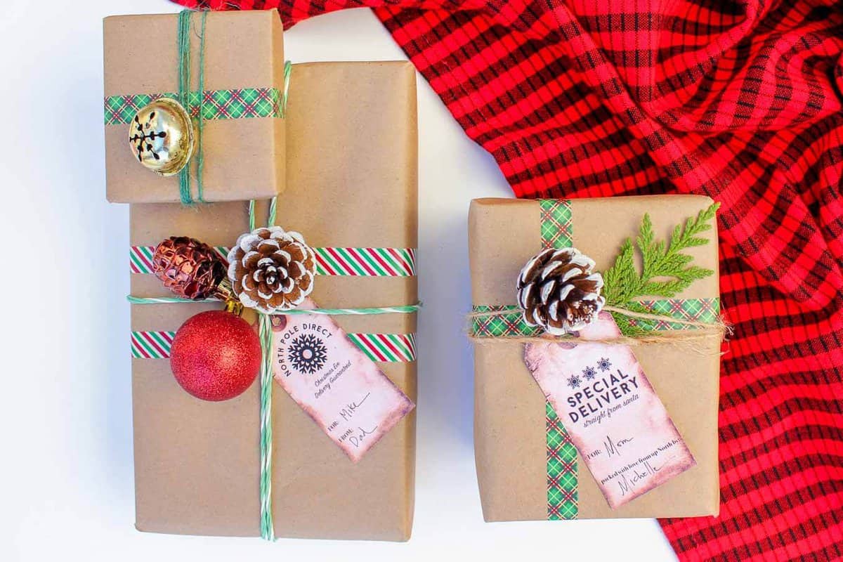 Christmas DIY gift wrap ideas with supplies from the dollar store. These gift topper ideas are sophisticated, festive and cheap! Click to see full tutorial. | MakeAndDoCrew.com