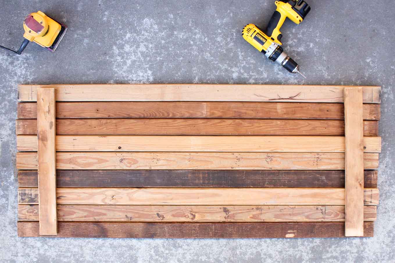 Instructions for how to build a double-sided DIY photography background out of reclaimed wood or new lumber. Perfect backdrop for blog photos, a wedding photo booth and Instagram or Etsy shots. Click for the full tutorial. | MakeAndDoCrew.com