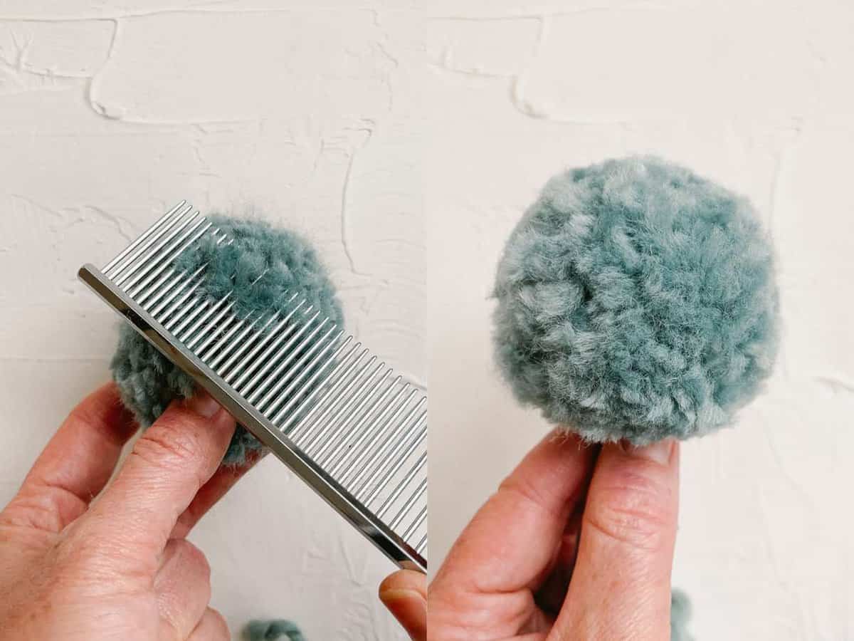 Yarn pom pom being brushed with metal comb to make it extra fluffy.