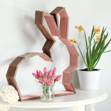 This bunny shelf makes a perfect Easter craft idea for Spring or DIY nursery decor to enjoy year round! Make it out of popsicle sticks using the free downloadable template. Click to see the full tutorial. | MakeAndDoCrew.com