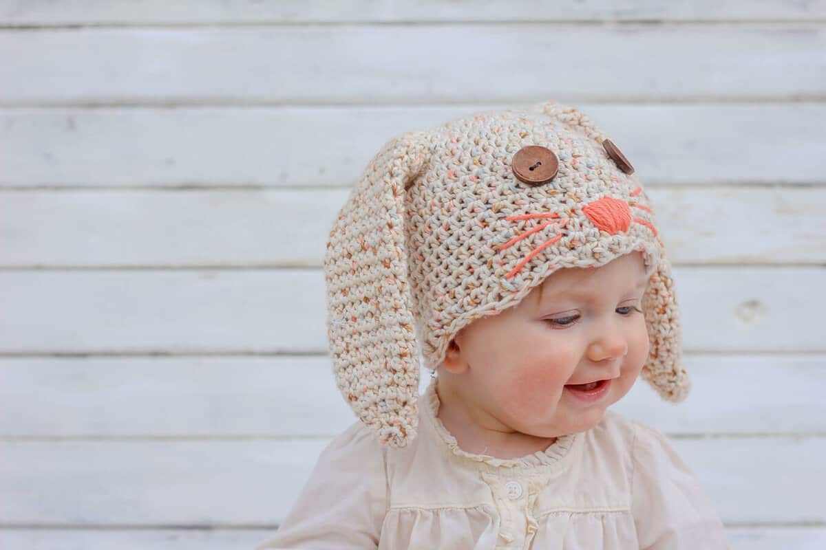 This free crochet bunny hat pattern makes a darling DIY Easter gift for your favorite baby or toddler. Sizes newborn, 3-6 months, 6-12 months, toddler/preschooler. Pair with our free crochet carrot baby toy pattern. Click for free pattern. | MakeAndDoCrew.com
