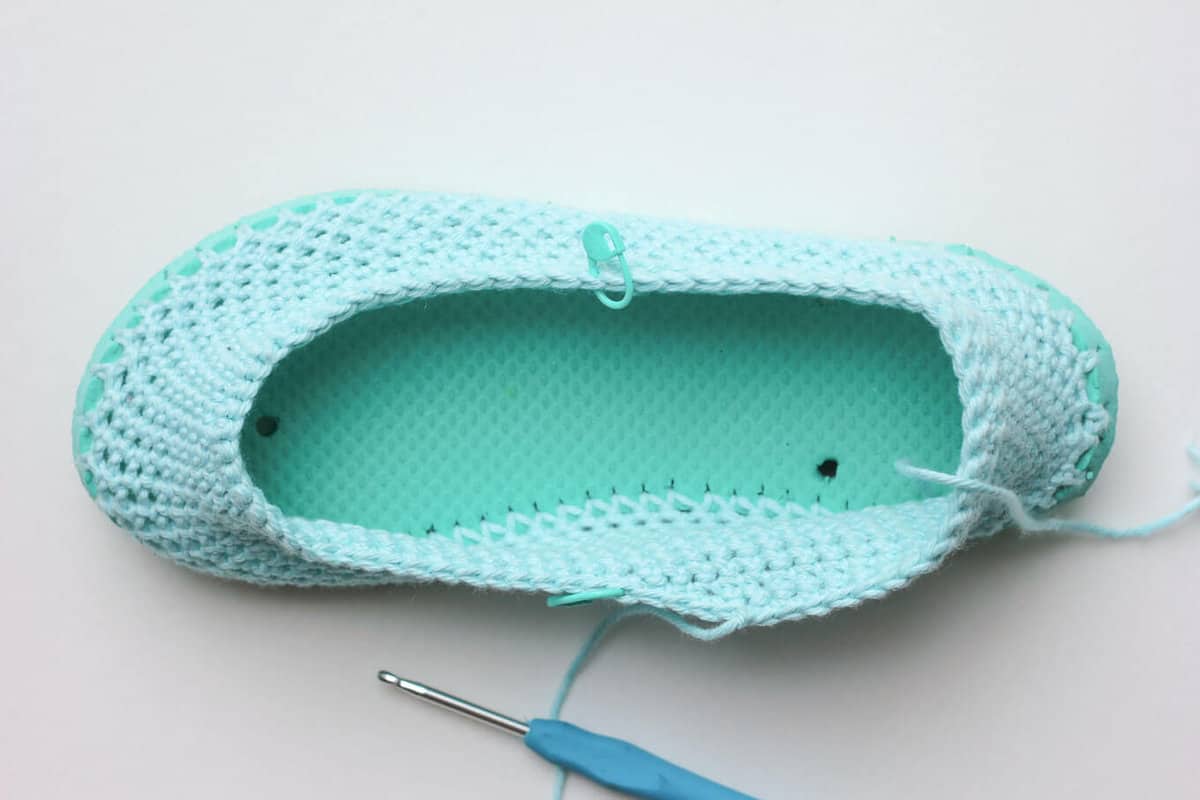 Cotton yarn and a flip flop sole make this free crochet slippers pattern perfect for warmer weather. Click to get the full pattern. | MakeAndDoCrew.com
