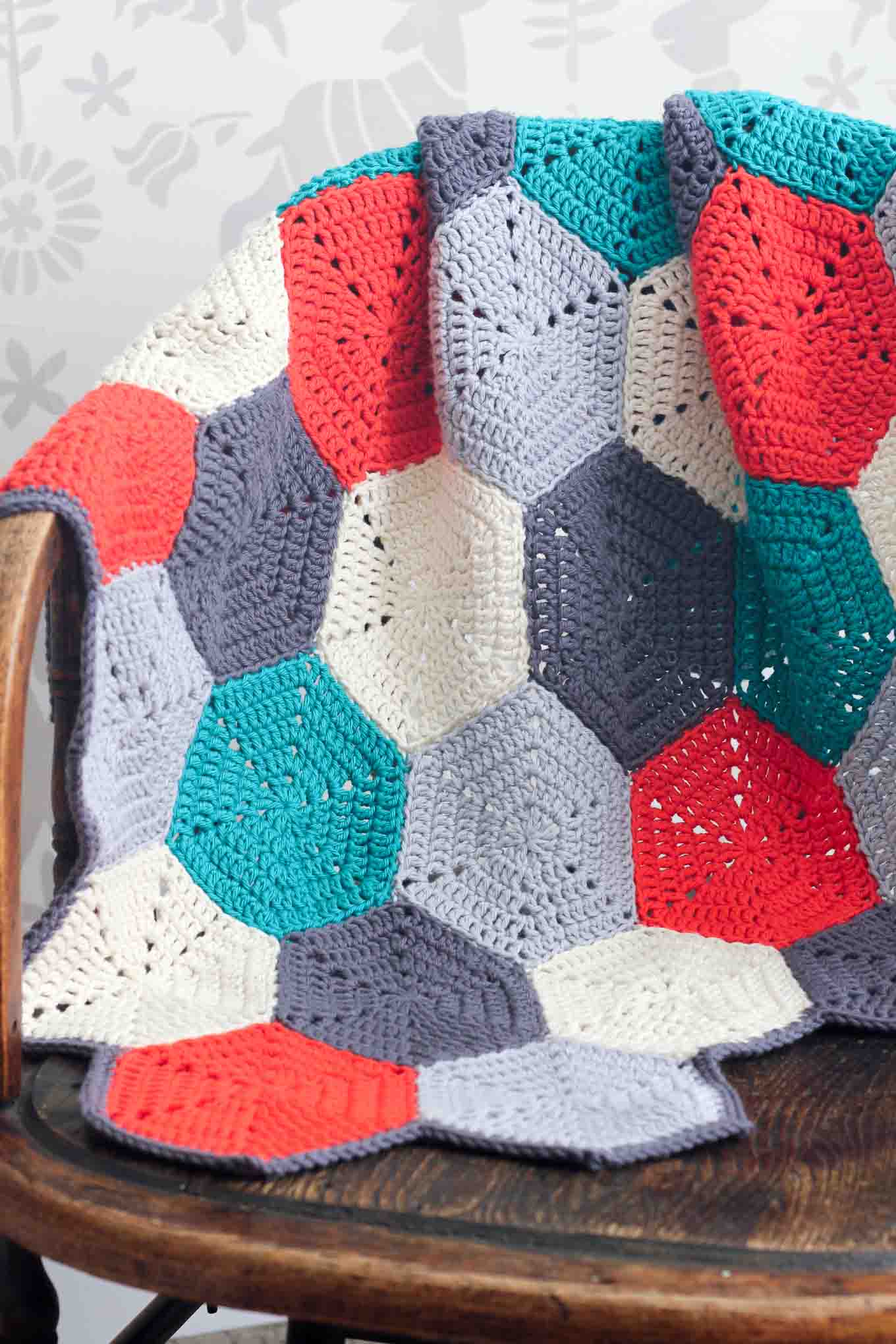 This free crochet afghan pattern is customizable, so you can use it to make a baby blanket, lap blanket or even a bedspread. Makes a great modern, gender-neutral baby shower gift idea or an afghan for the couch. Click for the free pattern and photo tutorial. | MakeAndDoCrew.com