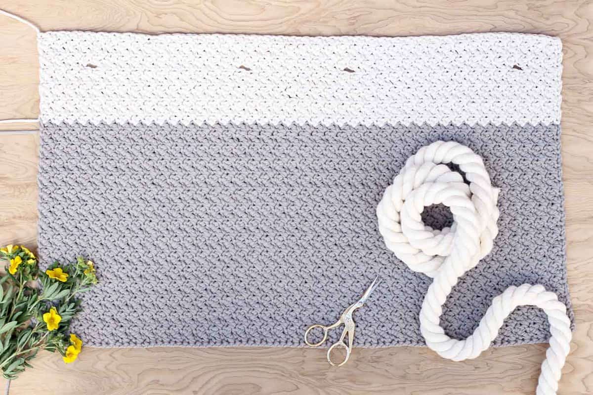 This free crochet bag pattern for beginners is deceptively simple because it's made from one large rectangle. Neutral colors and a beautiful texture combine in the perfect modern tote or oversized purse. Click for the full "Suzette" stitch tutorial and free bag pattern. | MakeAndDoCrew.com