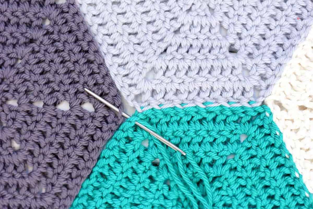 This photo tutorial will show you how to join crochet hexagons with a technique that results in an invisible seam. Great for sewing hexagons together, but can also work for granny squares or other crochet pieces. | MakeAndDoCrew.com