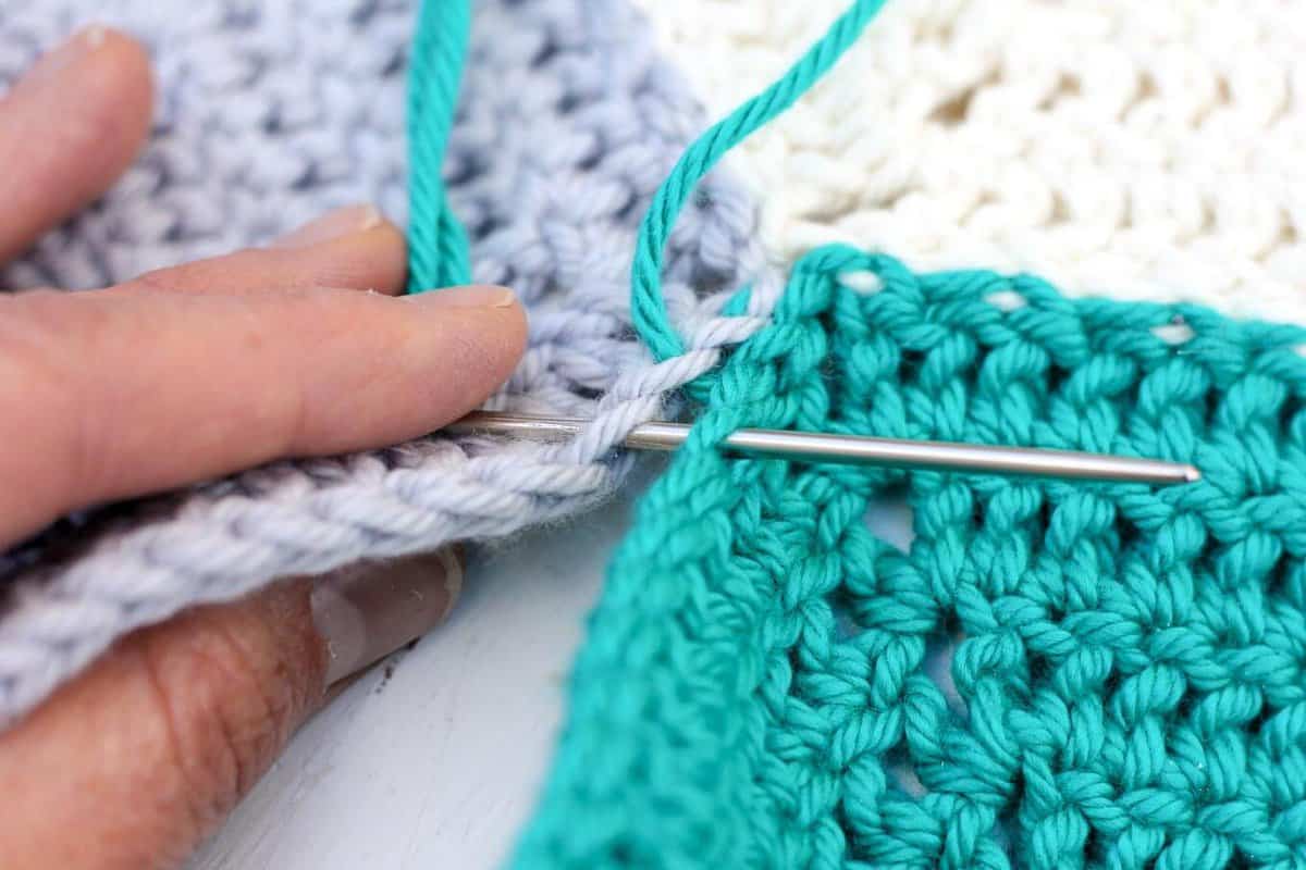 This photo tutorial will show you how to join crochet hexagons with a technique that results in an invisible seam. Great for sewing hexagons together, but can also work for granny squares or other crochet pieces. | MakeAndDoCrew.com