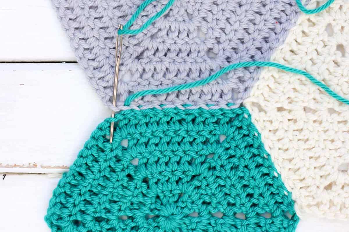 This photo tutorial will show you how to join crochet hexagons with a technique that results in an invisible seam. Great for sewing hexagons together, but can also work for granny squares or other crochet pieces. | MakeAndDoCrew.com