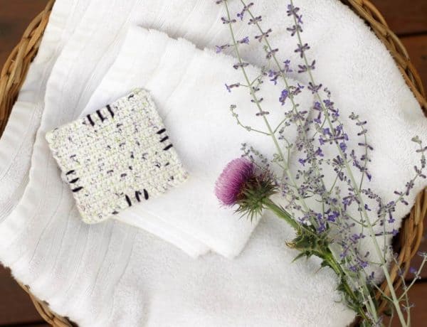 This free crochet pattern is perfect for beginners and a great way to use up dried lavender from your garden! Pop one of these crochet lavender sachets in the dryer and you've got natural and inexpensive way to keep your laundry smelling fresh! | MakeAndDoCrew.com