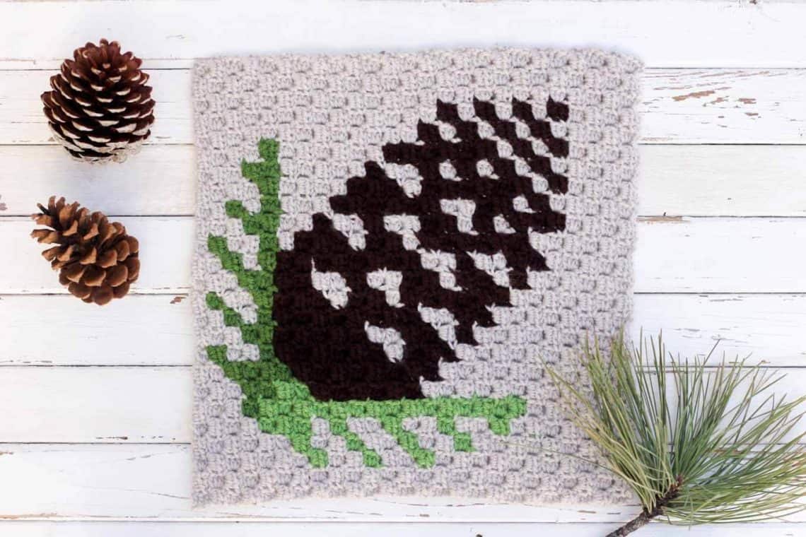 This free c2c crochet pinecone pattern makes a graphic, modern pillow or afghan square. Crochet several for cozy, rustic winter afghan or check out the rest of the Christmas corner-to-corner patterns to make a sampler afghan. Make with Lion Brand Vanna's Choice in coffee, kelly green, fern and ivory.