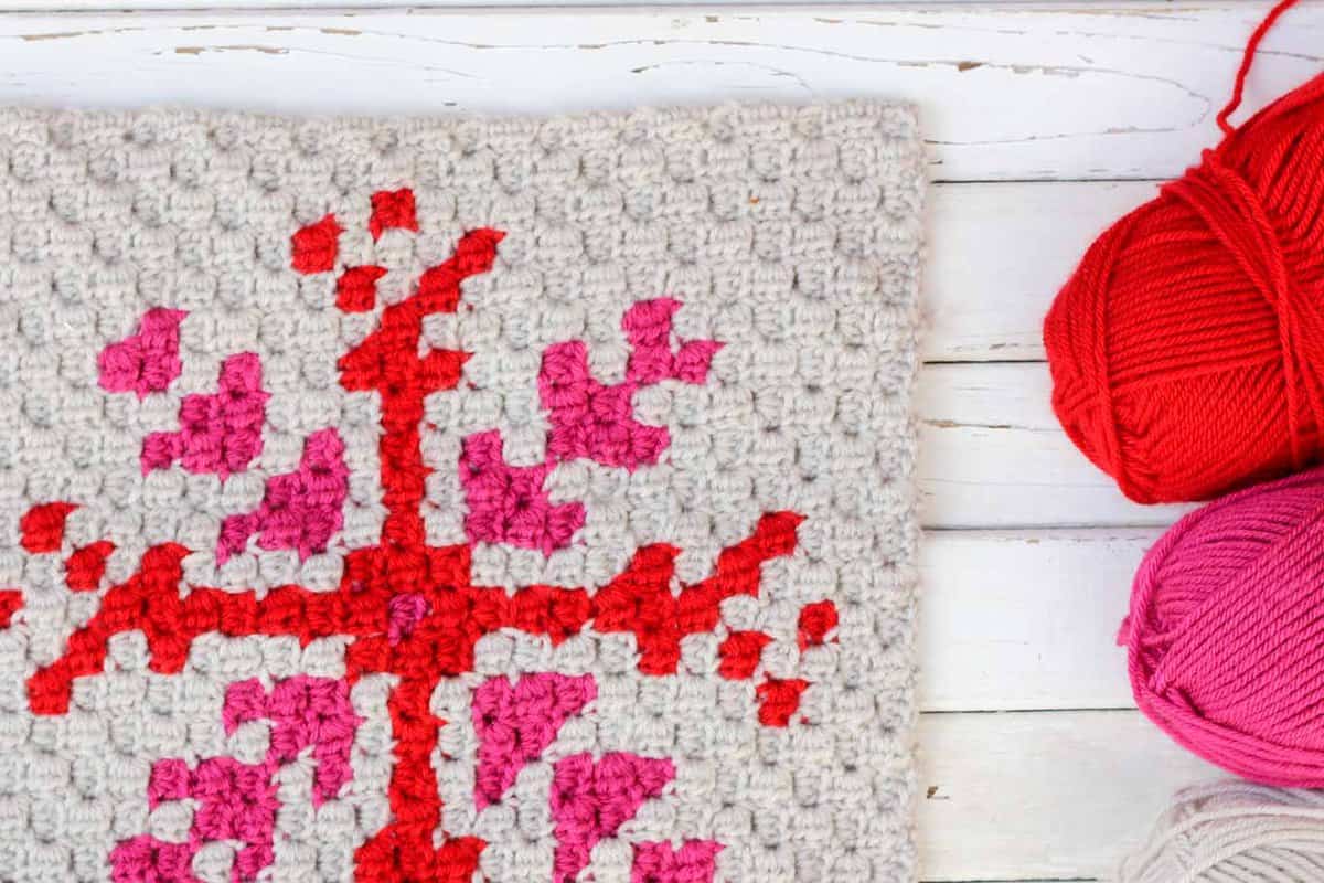 This free c2c crochet graph makes a graphic, modern, monochromatic snowflake. Crochet several for a bright, happy winter afghan or check out the rest of the Christmas corner-to-corner patterns to make a sampler afghan.