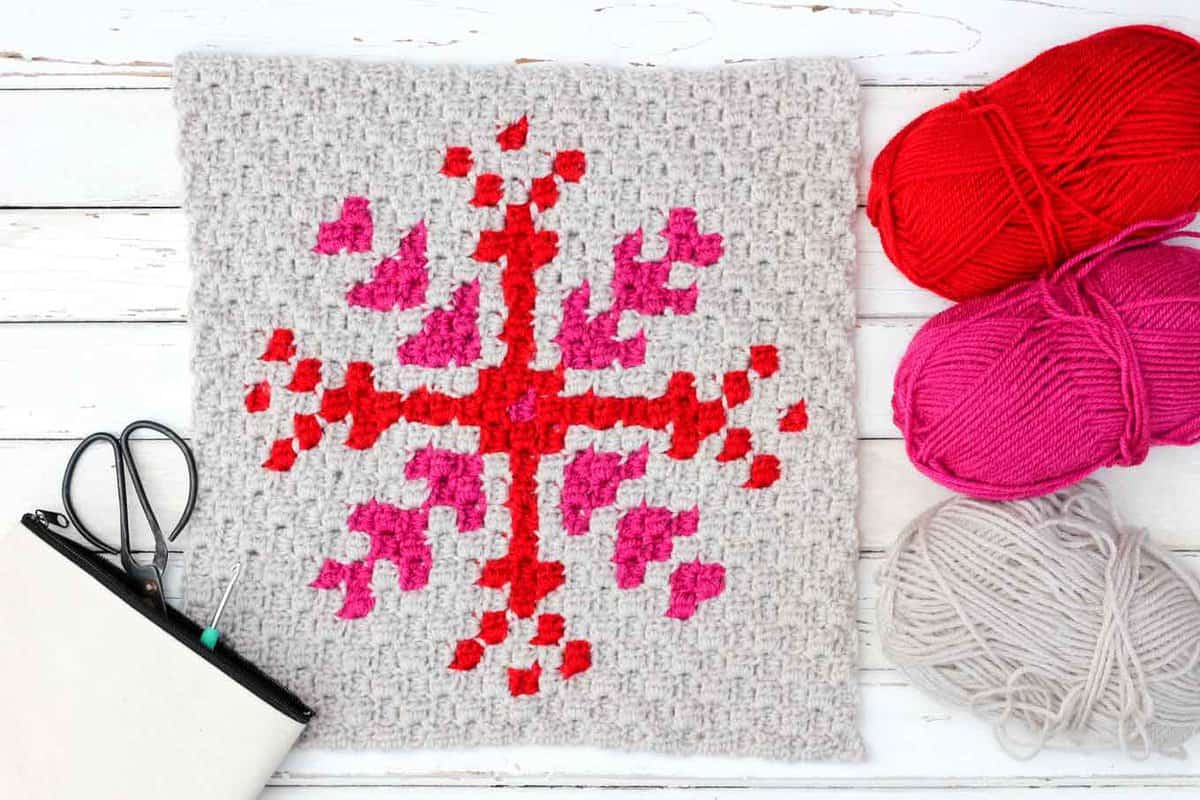 This free c2c crochet graph makes a graphic, modern, monochromatic snowflake. Crochet several for a bright, happy winter afghan or check out the rest of the Christmas corner-to-corner patterns to make a sampler afghan.