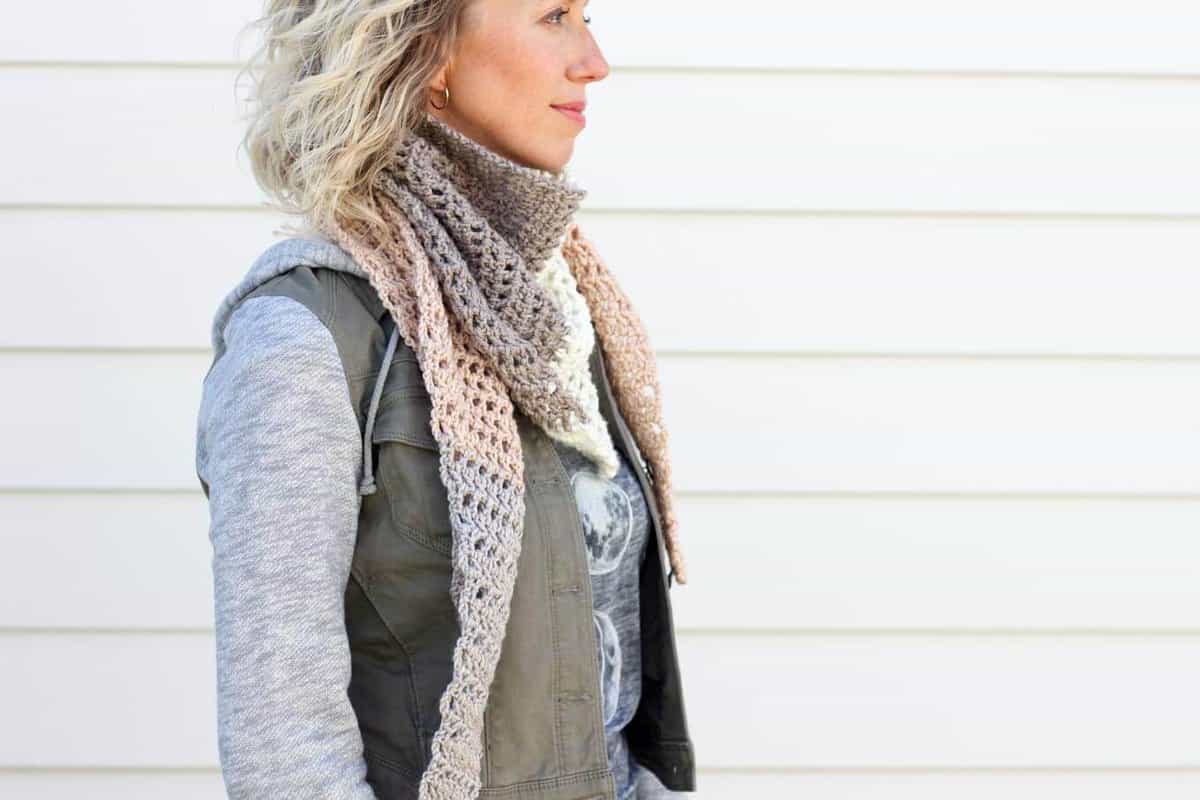 Toss on this modern crochet triangle scarf to head out to the desert, the mountains...or just the grocery store. This free Caron Cakes crochet pattern takes all the stress out of choosing colors because the skein does it for you! Color = Buttercream. 