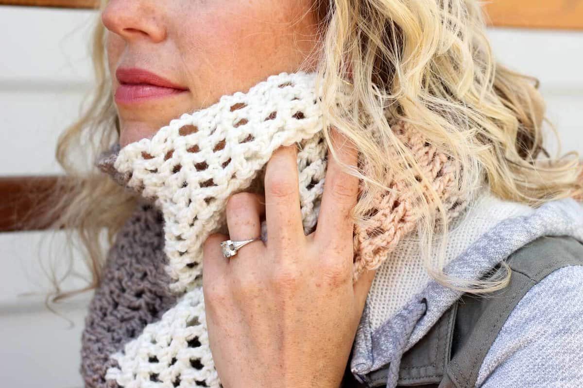 Toss on this modern crochet triangle scarf to head out to the desert, the mountains...or just the grocery store. This free Caron Cakes crochet pattern takes all the stress out of choosing colors because the skein does it for you! Color = Buttercream. 