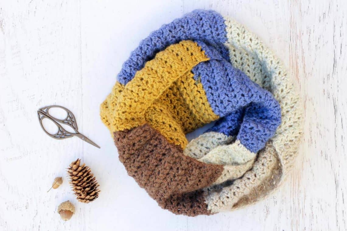This easy, modern "Piece of Cake Cowl" is going to become your go-to accessory for fall and winter! Plus, this Caron Cakes Yarn free crochet pattern is simple to make even if you're not an experienced pattern-reader. Simple one-skein crochet project! Caron Cakes color "Blue Icing."