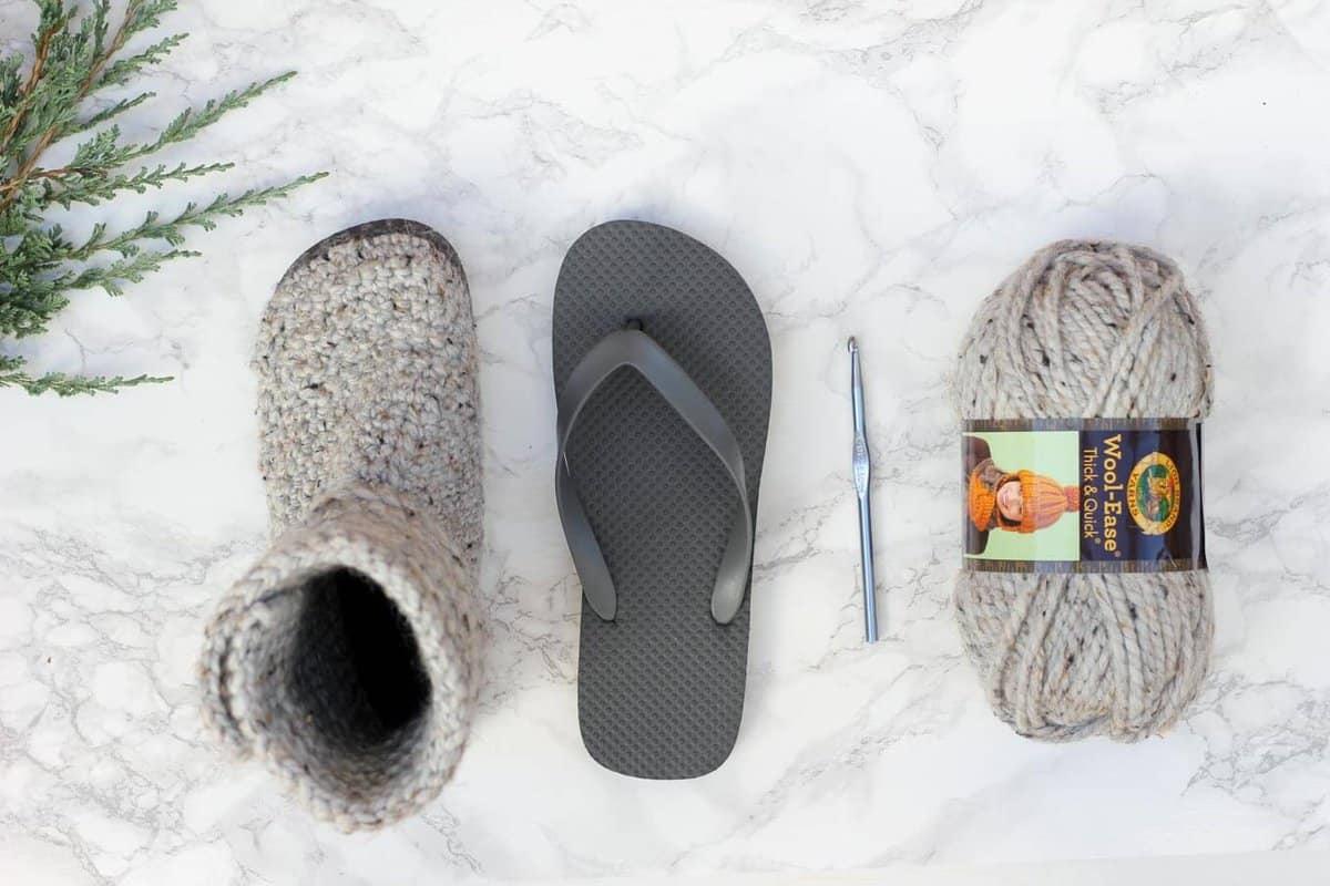 With this free pattern and crochet video tutorial you can make your own look-a-like crochet Uggs! These crochet boots with flip flops for soles make great outdoor shoes or house slippers. Made with Lion Brand Wool Ease Thick and Quick in Grey Marble.