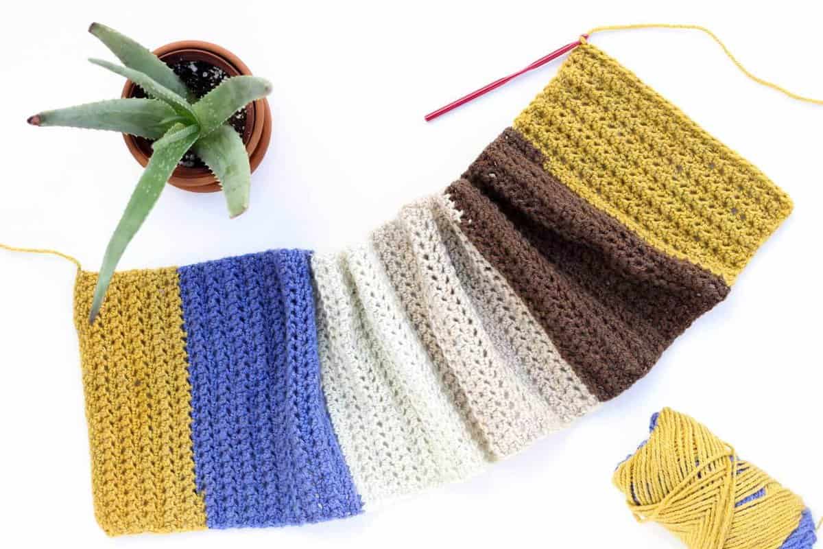 This easy, modern "Piece of Cake Cowl" is going to become your go-to accessory for fall and winter! Plus, this Caron Cakes Yarn free crochet pattern is simple to make even if you're not an experienced pattern-reader. Simple one-skein crochet project! Caron Cakes color "Blue Icing."