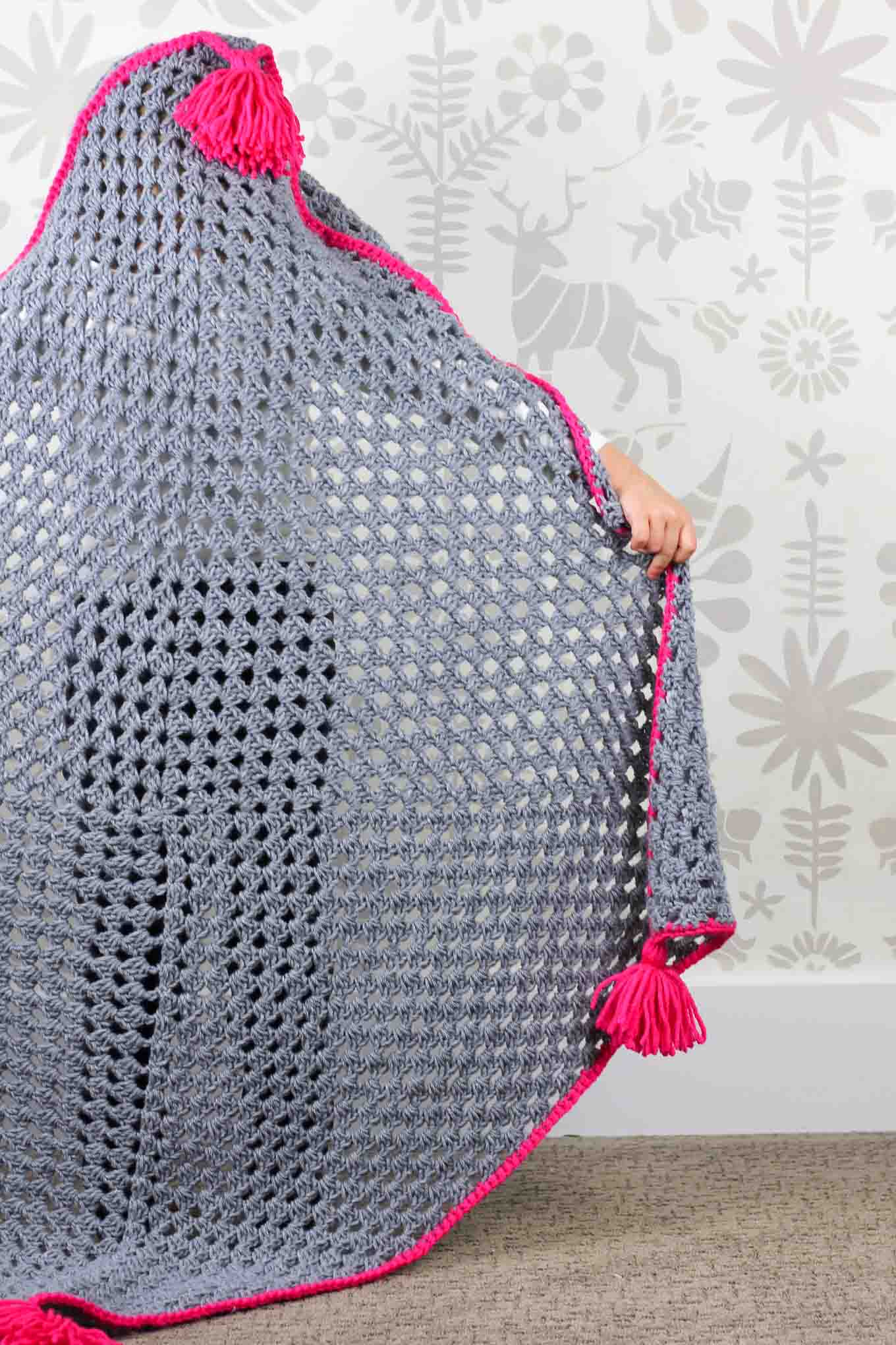 Based on a large granny square, the "Granny Gives Back" crochet hooded blanket pattern makes an easy and inexpensive project to donate to children's charities. The oversized hood and playful tassels will give any kid a safe, warm place to escape to. Click for the free granny square afghan pattern using Lion Brand Pound of Love yarn!