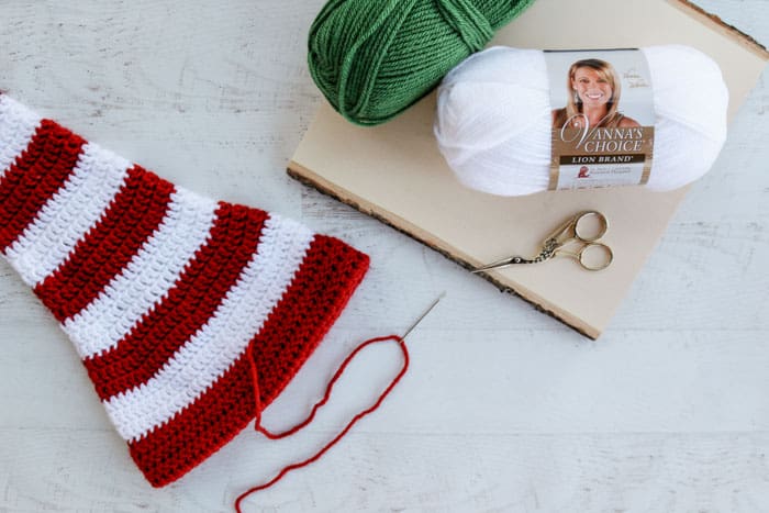 This free long tail crochet elf hat pattern with ears is made with Lion Brand Vanna's Choice yarn. 