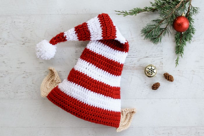 This free Santa's helper crochet elf hat pattern with ears makes a perfect creative family Christmas photo idea! Free pattern and tutorial in sizes newborn, baby, toddler, child, tween and adult.