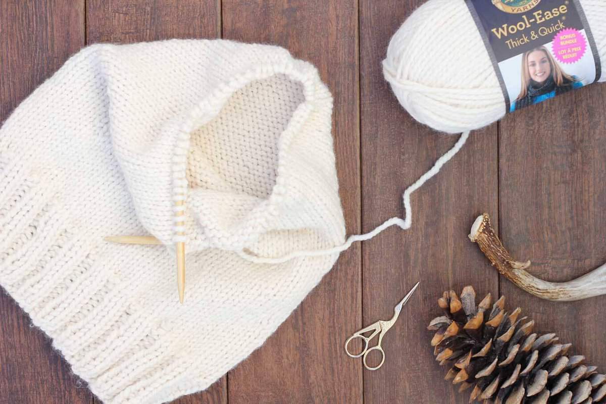 Simple knitting pattern! This free hooded cowl knitting pattern is a true showstopper! Even in all it's oversized glory, it's very simple to create which makes it a great beginner pattern for learning how to knit in the round. Made with Lion Brand Wool-Ease Thick & Quick in "Fisherman."