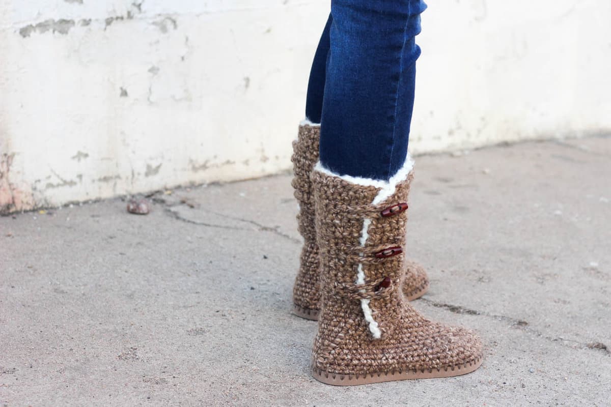 Learn how to make crochet UGG boots with flip flop soles in Part 1 of this free crochet pattern and video tutorial. This adult-sized pattern makes super cozy slippers or even crochet shoes to wear outside. Made with Lion Brand Wool Ease Thick and Quick in "Toffee."