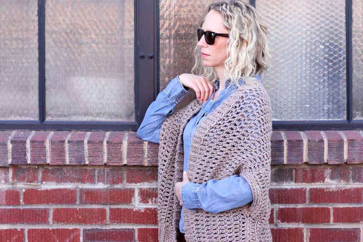 You'd never guess by looking at this sweater that it's made from two simple rectangles! The Cocoon Cardigan free crochet pattern is great for beginners who are looking to expand their skills or advanced crocheters who want a quick, stylish project. Made with Lion Brand Lion's Pride Woolspun yarn in "Taupe." 