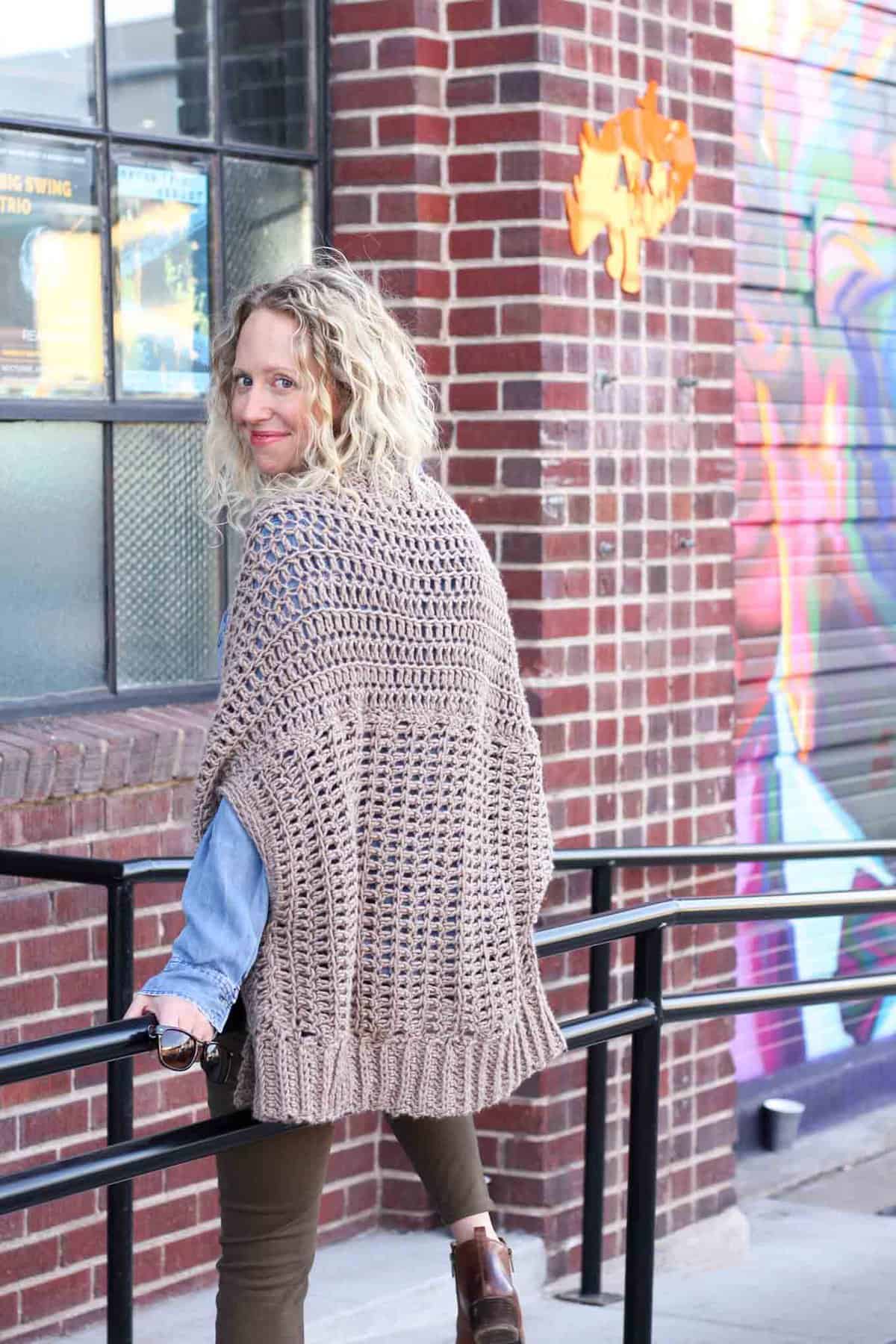 You'd never guess by looking at this sweater that it's made from two simple rectangles! The Cocoon Cardigan free crochet pattern is great for beginners who are looking to expand their skills or advanced crocheters who want a quick, stylish project. Made with Lion Brand Lion's Pride Woolspun yarn in "Taupe." 