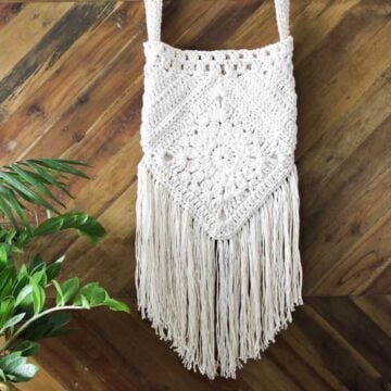 Boho love! This free boho crochet purse pattern is fun to put together and loaded with bohemian charm. Made with Lion Brand Kitchen Cotton in "Vanilla."