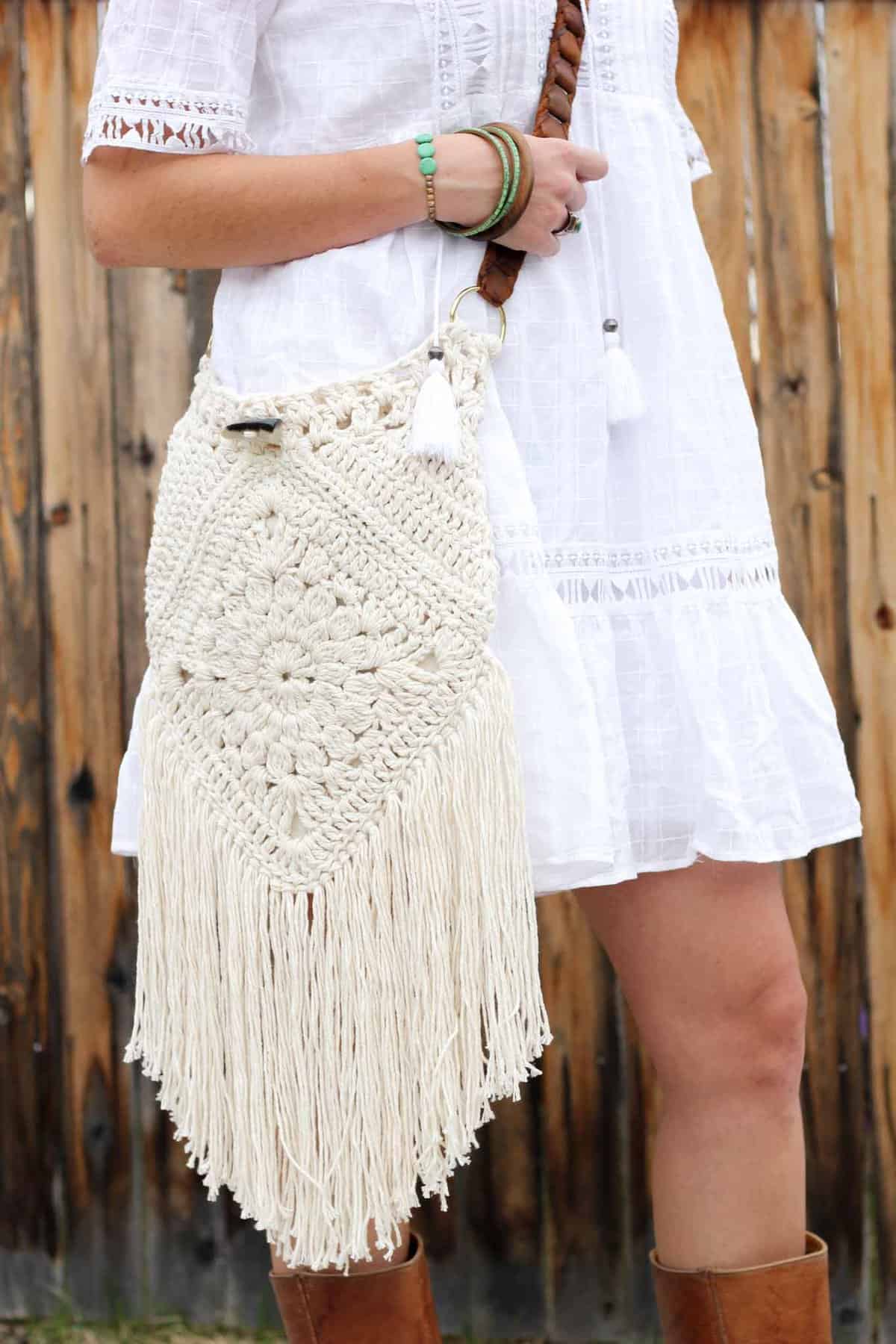 Boho love! This boho bag free crochet pattern is fun to put together and loaded with bohemian charm. Made with Lion Brand Kitchen Cotton in "Vanilla."