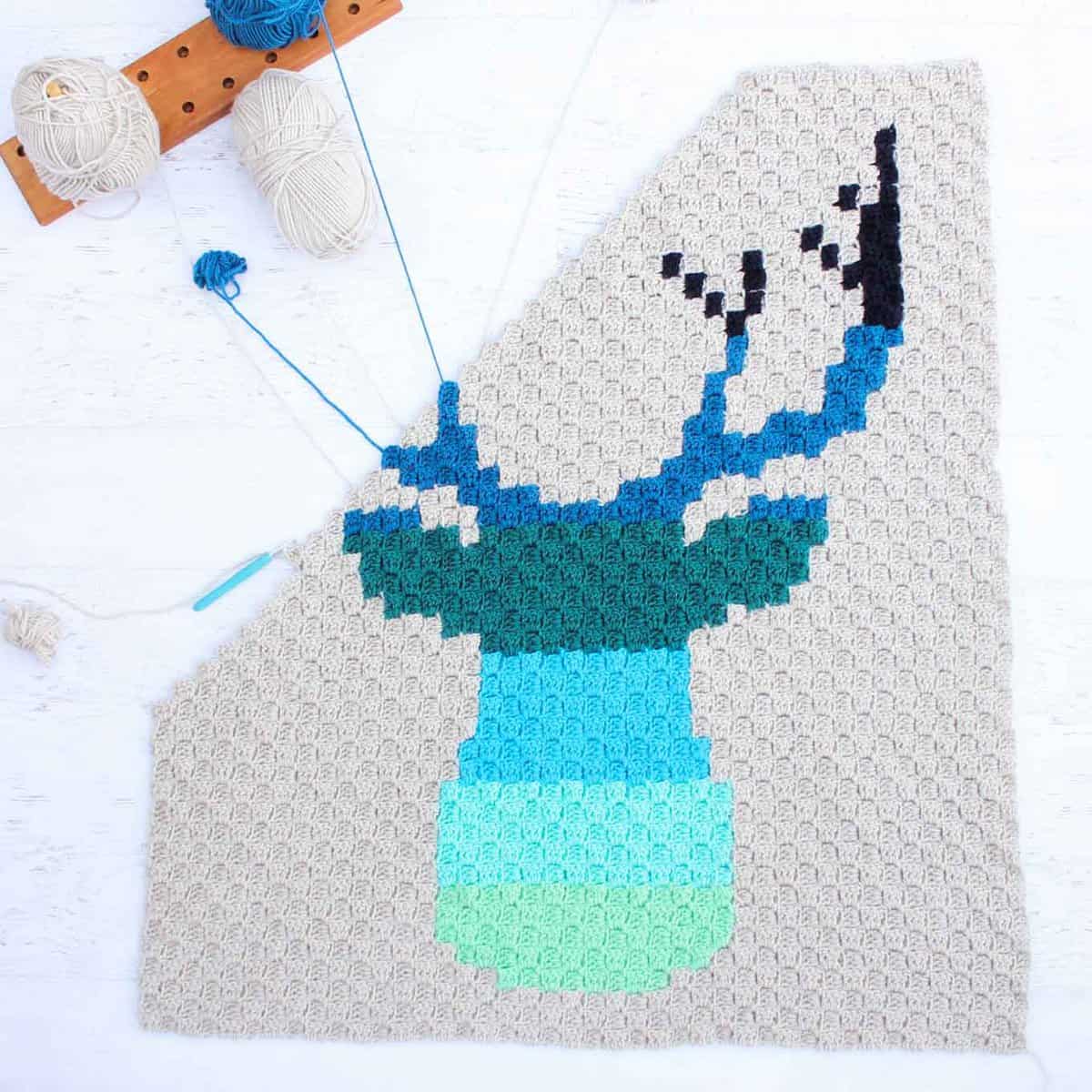 Hello ombre! This corner to corner crochet deer buck afghan will be a hit with your favorite baby, hipster or hunter! Download the free ombre deer c2c graph to make a baby blanket or larger throw. Made with Lion Brand Vanna's Choice yarn. | MakeAndDoCrew.com