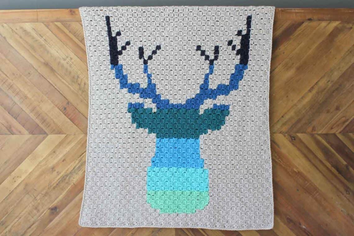Hello ombre! This corner to corner crochet deer afghan will be a hit with your favorite baby, hipster or hunter! Download the free ombre deer c2c graph to make a baby blanket or larger throw. Made with Lion Brand Vanna's Choice yarn. | MakeAndDoCrew.com
