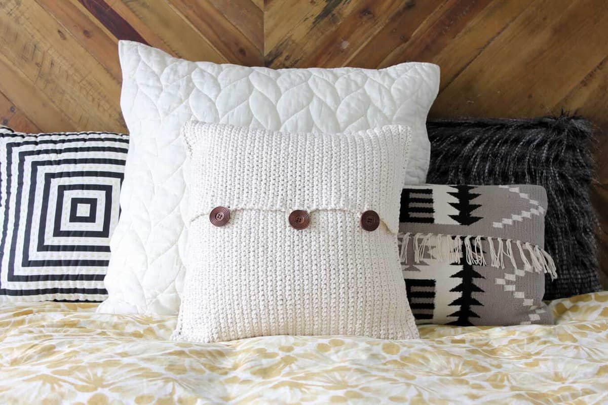 Beginner crochet pattern. Modern mudcloth pillow with button closures. Make and Do Crew.