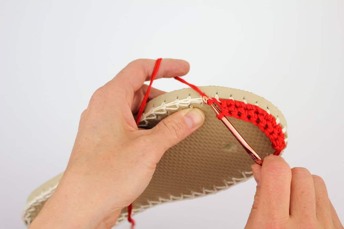 Lion Brand 24/7 Cotton in "Red" used to make the toe of a crochet espadrilles shoe.