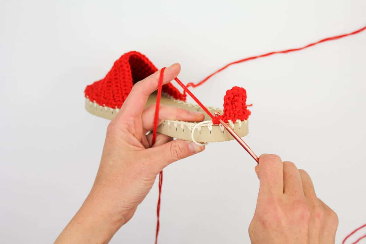 Learn how to make crochet espadrilles with flip flop soles in this free pattern and tutorial from Make and Do Crew! These crochet sandals feature Lion Brand 24/7 Cotton in "Red."