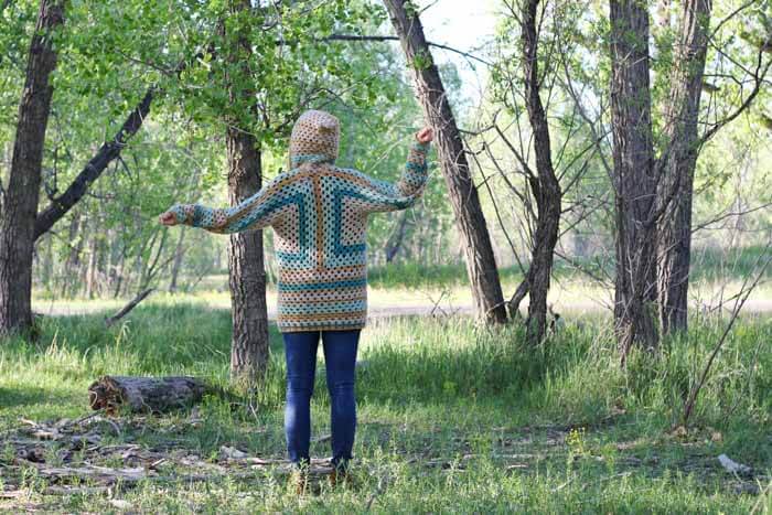 Free crochet sweater pattern that uses the granny stitch to make a modern cardigan. This pattern features Lion Brand New Basic 175 yarn in Thyme, Camel, Juniper and Cafe Au Lait.