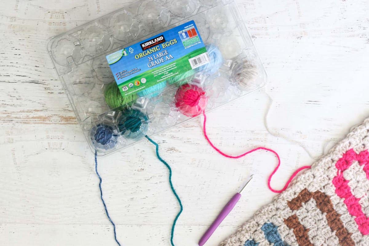 Dividers, holes, yarn. Perfect to use on multi yarn projects or even just  to organize yarn.