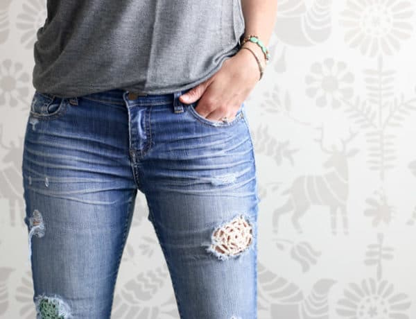 Jeans that have been patched with lace crochet doilies. Such a fun boho style! Full how to tutorial from Make & Do Crew.