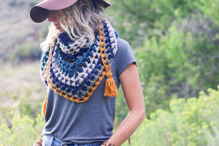 Bohemian style crochet scarf paired with a wool hat. Perfect modern crochet look for fall!