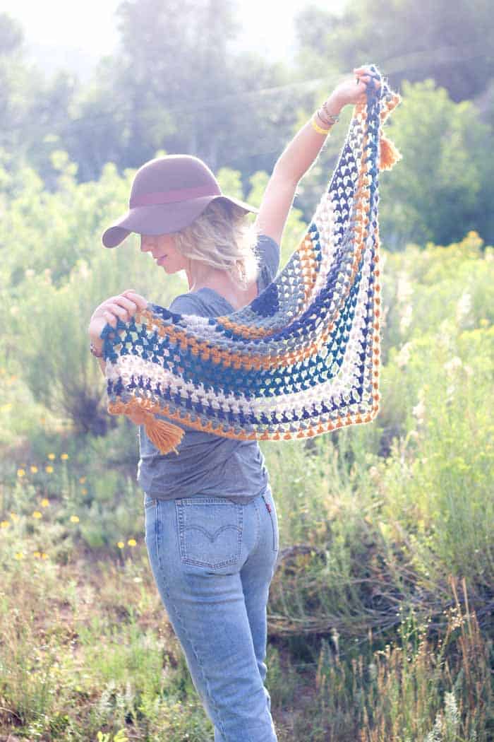 Worked in a vintage-inspired, boho color palette of LB Collection Merino Yak Alpaca, this crochet triangle scarf pattern with tassels is a versatile piece that’ll keep you cozy until the tulips start blooming again. Free crochet pattern and video tutorial!