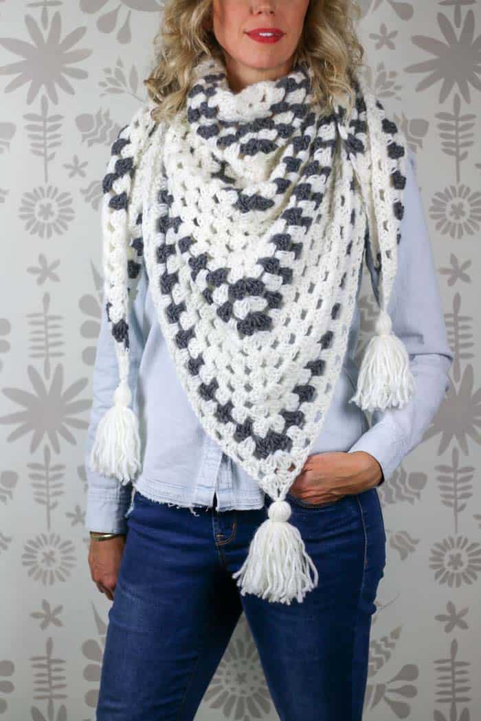 Free crochet triangle scarf pattern using the granny stitch. Made with Lion Brand New Basic 175 yarn. 