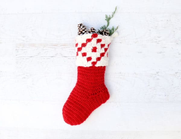 This free corner to corner (c2c) crochet pattern makes a gorgeous modern crochet Christmas stocking. The free pattern and tutorial make this heirloom easy to create in time for Christmas!