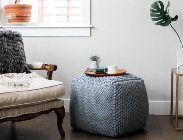 Learn some new stitches while crocheting your own oversized pouf ottoman. This free crochet bean bag pattern is comprised of six simple squares and stuffed with inexpensive household items to create a high-end looking piece of DIY furniture.