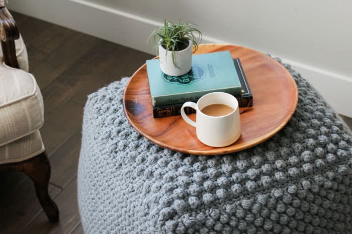 How to crochet a bean bag or pouf that you can use as an end or side table. Free crochet pattern using Lion Brand Pound of Wool in Grey Oxford.