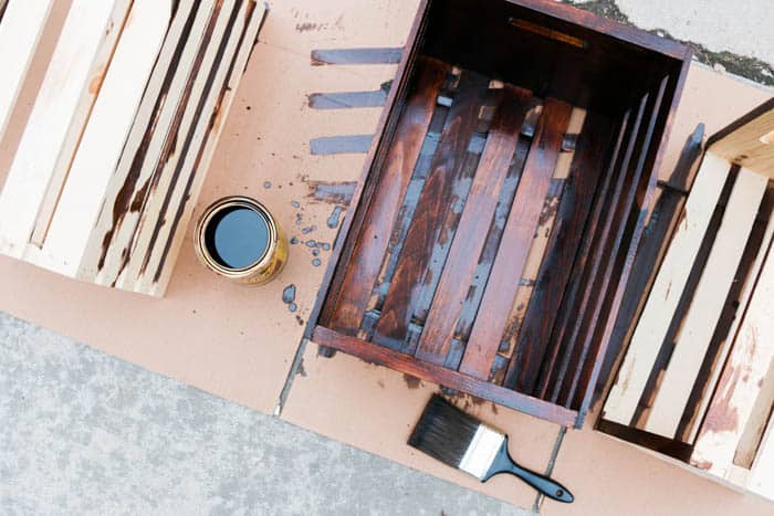 Build modern bookshelves using wooden crates. Perfect craft room organization idea!