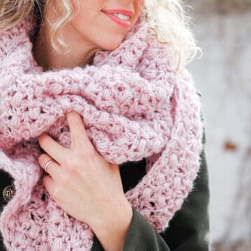 The At First Blush triangle scarf is an easy lace crochet shawl pattern, free from Make and Do Crew featuring Lion Brand Touch of Alpaca yarn.