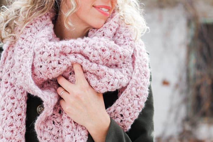 The At First Blush triangle scarf is an easy lace crochet shawl pattern, free from Make and Do Crew featuring Lion Brand Touch of Alpaca yarn.