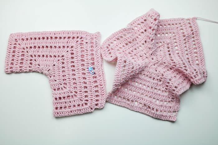 How to crochet a child's sweater out of two hexagons with eyelets, featuring Lion Brand yarn.